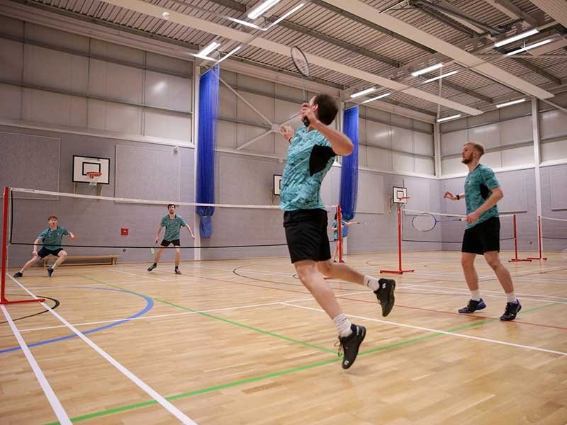 Badminton player practising on a premium court