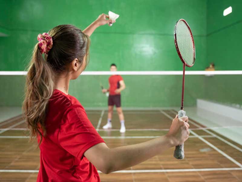 Badminton match in a modern indoor court