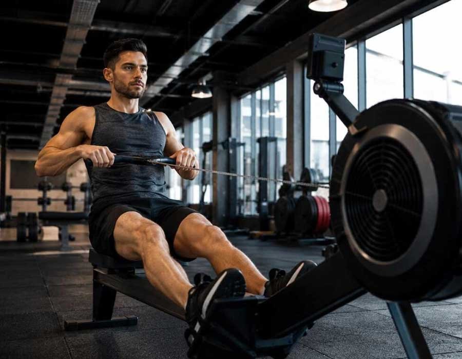 Professional fitness trainer guiding a member during a workout