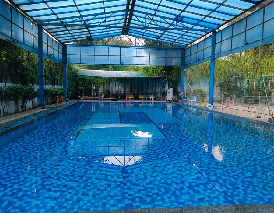 Clean premium swimming pool with clear blue water
