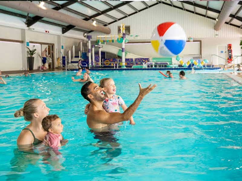 Member swimming laps in a clean premium pool